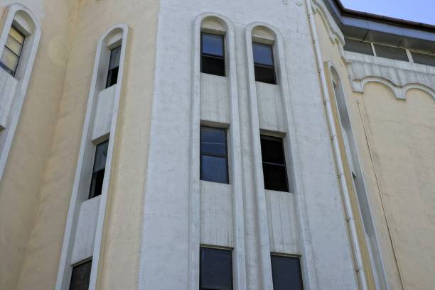 istock a row of old windows on the gray brown concrete wall 1196271796