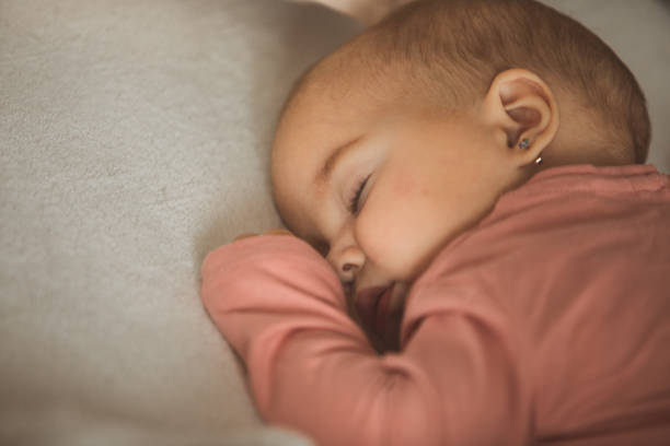 istock Sleeping baby girl 1196271962