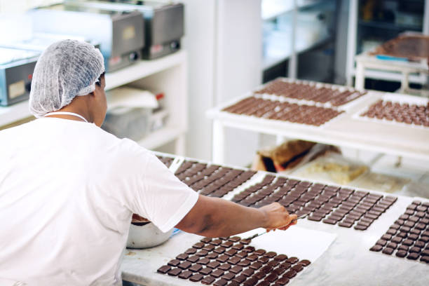 istock Woman preparing chocolate in a factory 1196272067