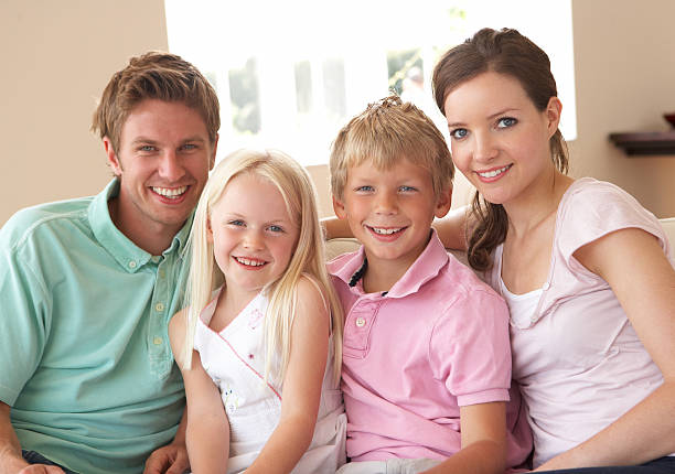 istock Family Sitting On Sofa At Home 119627489