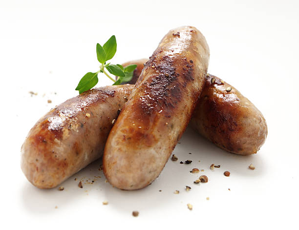 Sausages with herbs  sausage stock pictures, royalty-free photos & images
