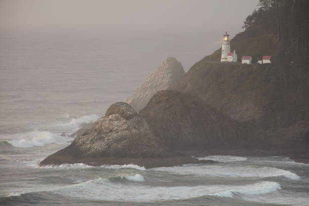istock Heceta Head Lightouse with Fog after Dusk 1196281058