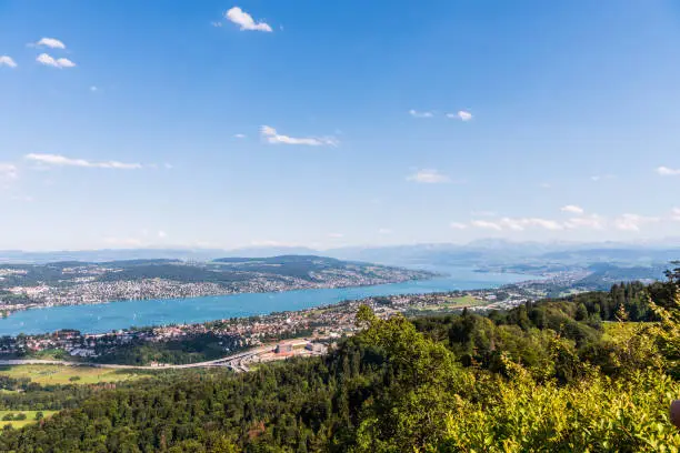 Panorama of  the of old downtown of Zurich city, with beautiful house at the bank of Lake of Zurich.  Aerial view from the the top of Mount Uetliberg
