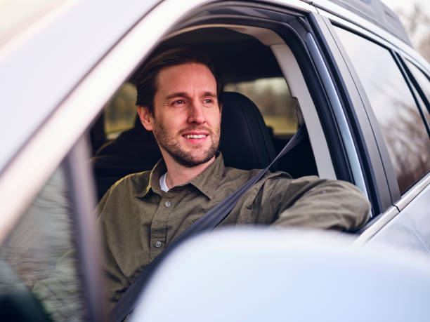 istock Adult Man Driving a Car 1196283778