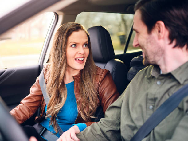 istock Adult Couple Driving a Car 1196283782