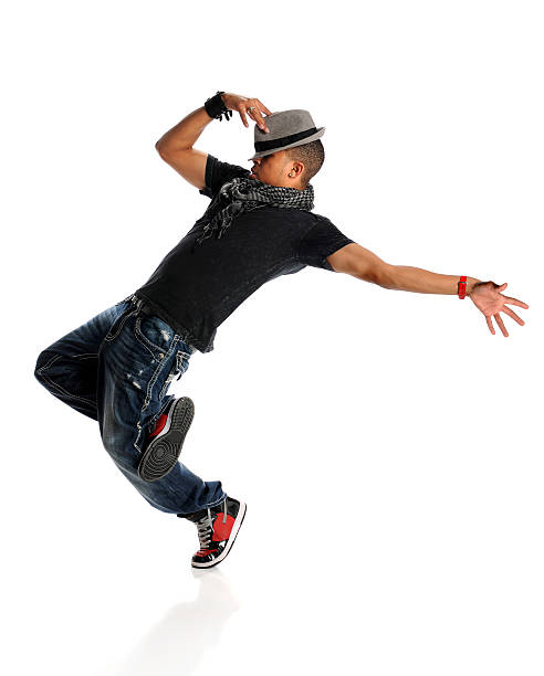 A hip hop dancer wearing a gray hat and a black shirt stock photo