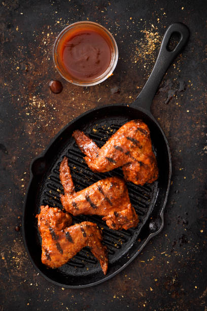 Barbecue grilled chicken wings in a griddle