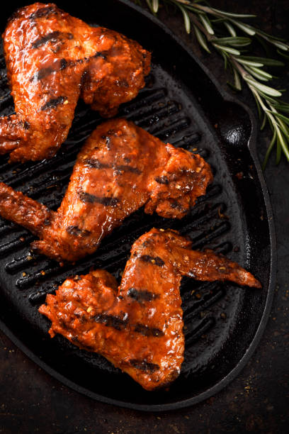 istock Barbecue grilled chicken wings in a griddle 1196298915