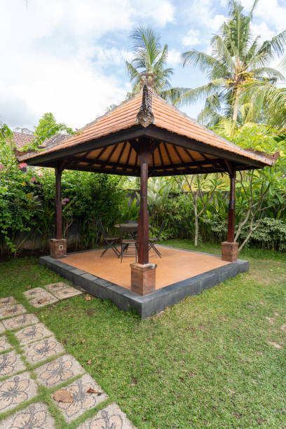 istock Gazebo with metal chairs and table on backyard 1196306786