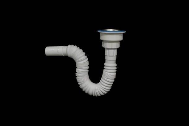 istock White sink pipe isolated on black background. Plastic sink water drain pipe plumbing tool. 1196308482