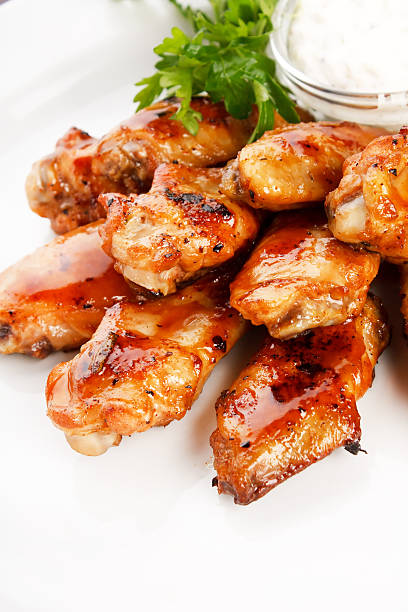 Chicken wings with sauce stock photo