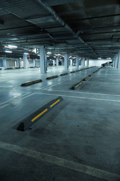 istock Vertical image of empty underground parking lot 1196317942