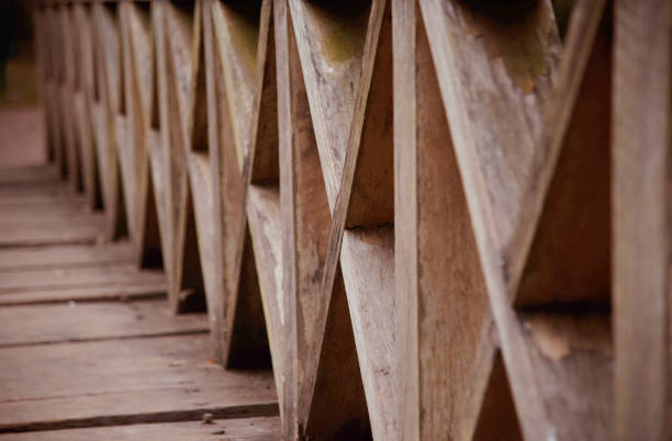 istock Wooden made structures of a bridge around a park 1196320830