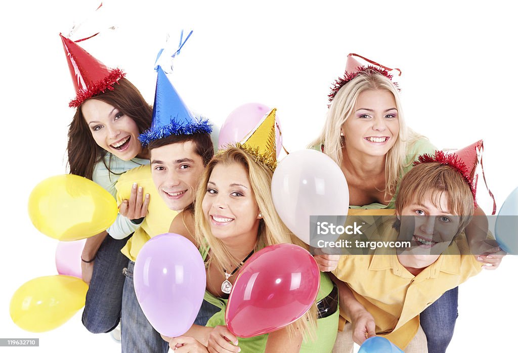 若者のグループでのパーティの帽子保持バルーンます。 - カットアウトのロイヤリティフリーストックフォト