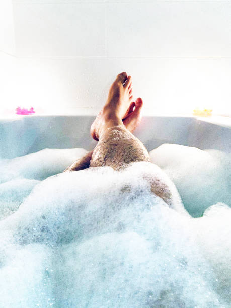 istock male relaxing in a bath tub 1196328578
