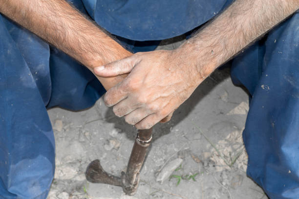 a man holding an axe  and cutting trees for timber mafia