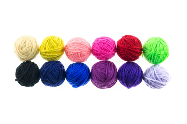 balls of wool on a wooden background