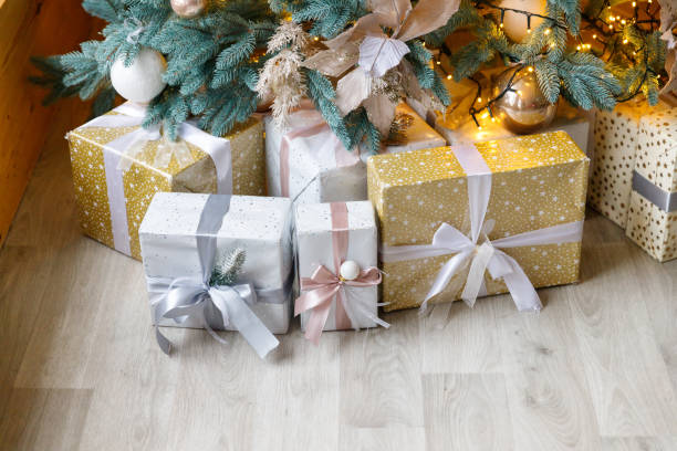 istock Beautiful Christmas tree decorated with toys and gift boxes 1196338962