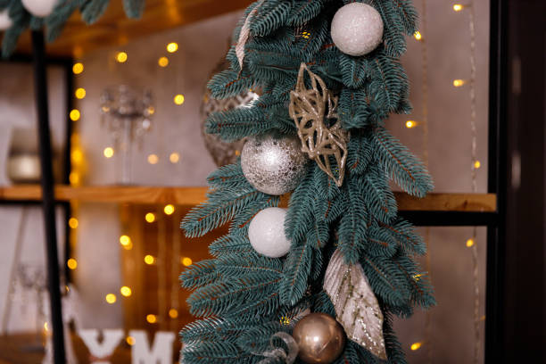 istock Christmas tree decorated with beautiful toys on a studio background. 1196339102