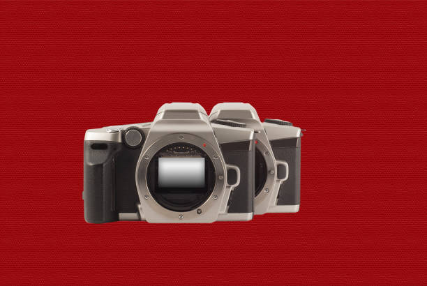 istock 35 mm analog camera on a red background. Film camera. 1196339225