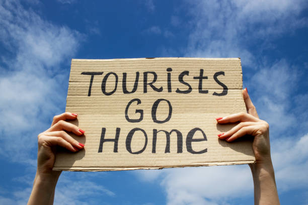 istock Tourists go home concept. 1196340449