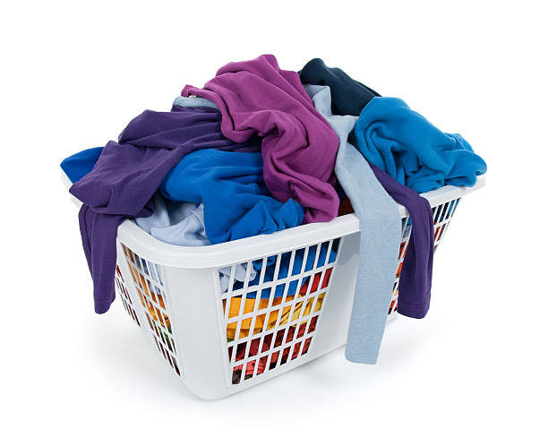 istock Bright clothes in laundry basket. Blue, indigo, purple. 119634107