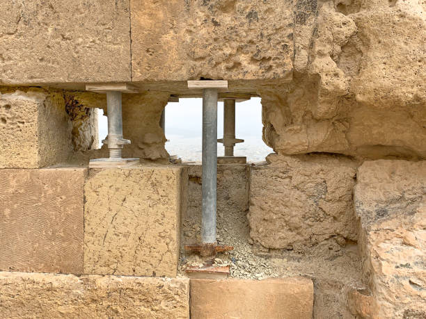 istock Temporary steel pillars support an ancient stone wall 1196342923