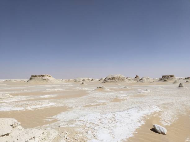 istock Farafra (White Desert), a geological depression covered by chalk rock formations in Egypt 1196345612