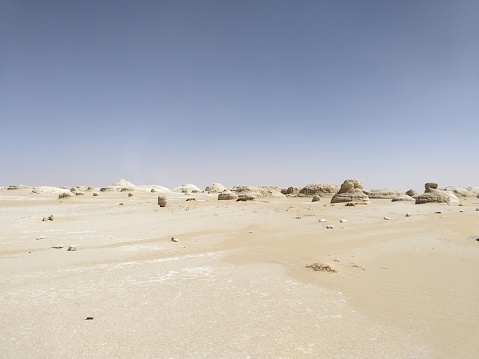 Egypt: 26 March 2019 - a plain inside the White Desert, with unearthly and beautiful wind-carved chalk rock formations