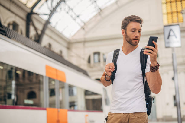 istock Handsome man on train station in city 1196346051