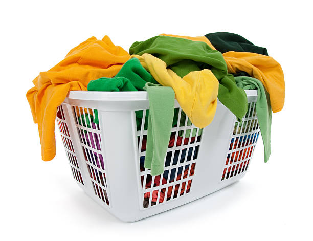 istock Bright clothes in laundry basket. Green, yellow. 119635132