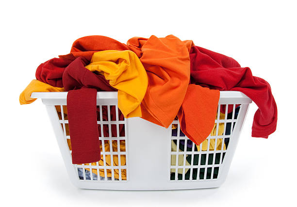 istock Colorful clothes in laundry basket. Red, orange, yellow. 119635134