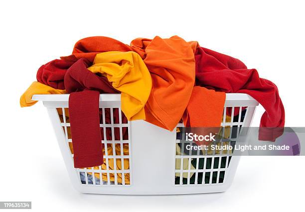Foto de Roupas Coloridas Em Cesta De Lavanderia Vermelho Laranja Amarelas e mais fotos de stock de Algodão - Material Têxtil