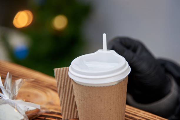 istock Disposable plastic cup in paper packaging with a hot drink. 1196351482