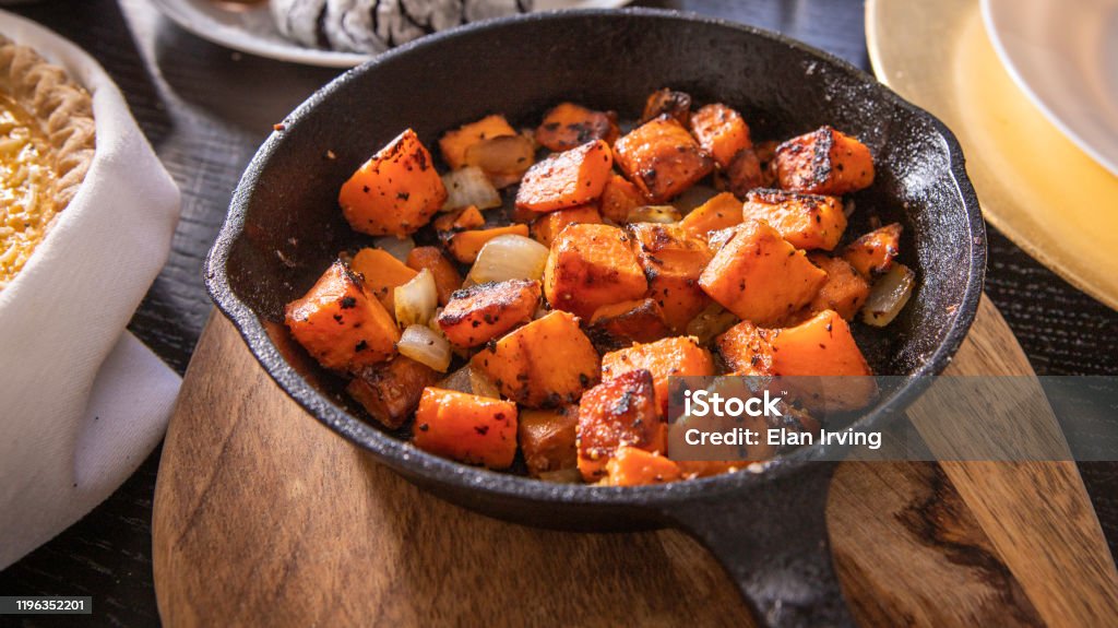 Roasted Sweet Potatos Sweet potatoes roasted in a cast iron skillet Sweet Potato Stock Photo
