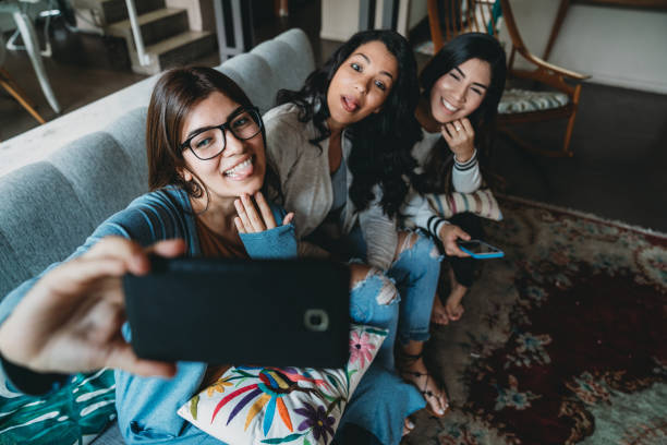 istock Three friends taking a selfie together 1196352210
