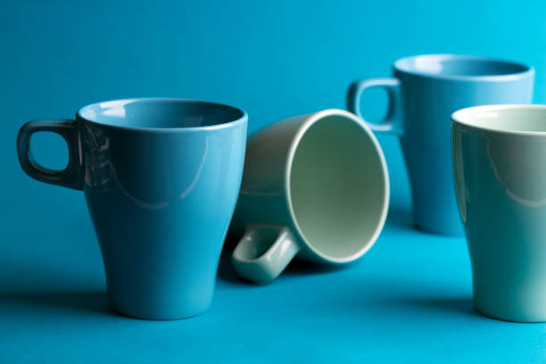 istock bright ceramics - cups in blue colors on a blue background