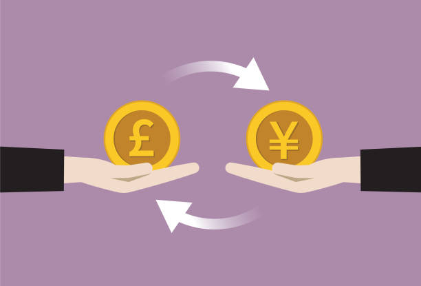 istock Businessman exchange currency between UK pound coin with YEN coin 1196354768