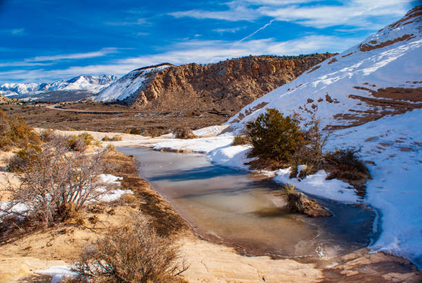 Snow and Ice Covers the White Rocks Amphitheatre at Snow Canyon State Park Snow Canyon State Park, Utah, USA snow canyon state park stock pictures, royalty-free photos & images