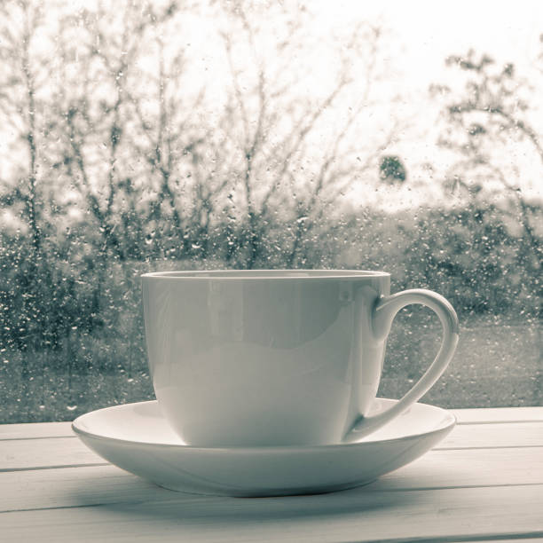 istock Coffee cup over mirror background in rainy day,copy space 1196358215