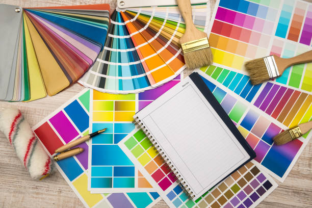 istock Colour palette with painting tools and empty notepad for design. 1196364056