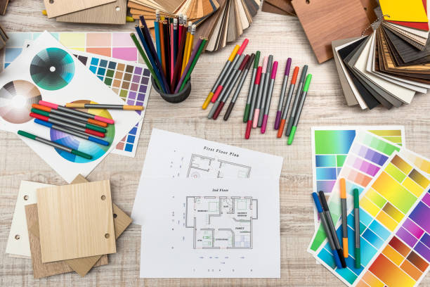 istock Colour palettes with house plan on desk top view. Designer working at new project 1196365113