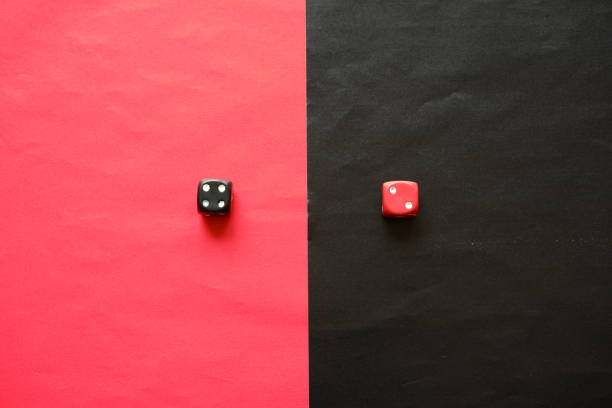 istock Red dice shows two and black dice shows four. 1196368501