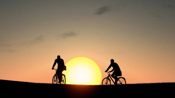 istock Man With Bicycle Silhouette at Sunset 3D Rendering 1196369176