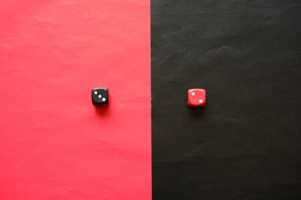 istock Red dice shows two and black dice shows three. 1196370396