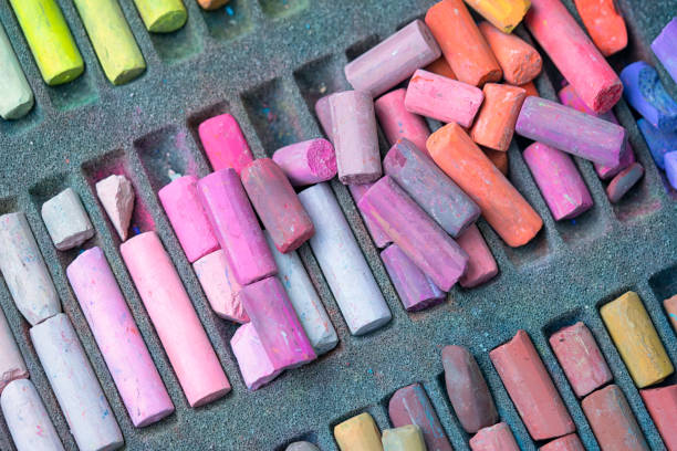 Chalk sticks various colors in a box close up, colorful chalk pastel for preschool children, kid stationary for art painting education. Chalk sticks various colors in a box close up, colorful chalk pastel for preschool children, kid stationary for art painting education. pastel crayon photos stock pictures, royalty-free photos & images