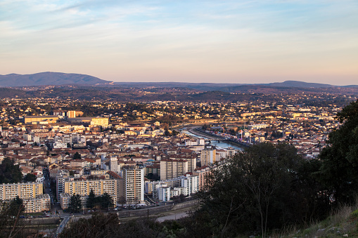 View of the city of Alès and its countryside from the heights of the city during sunset.