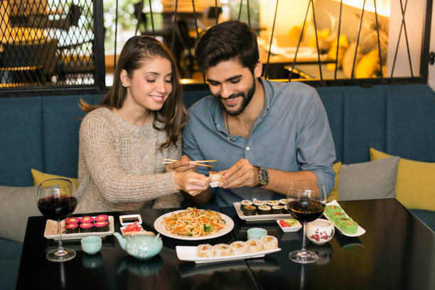 istock Smiling couple having a meal 1196373227