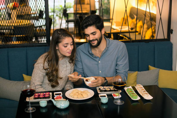 istock Couple eating dumplings 1196373258