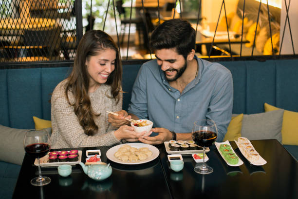 istock Couple eating dumplings 1196373279